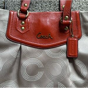 Coach bag, cloth with leather accents.